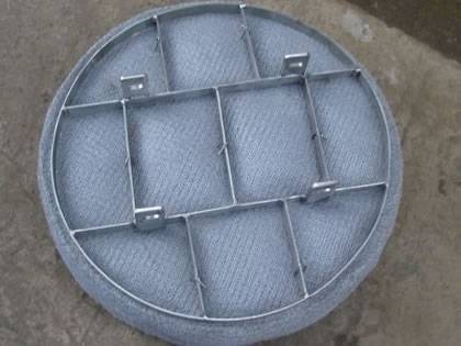 Circle shape SS demister pad with support grid.