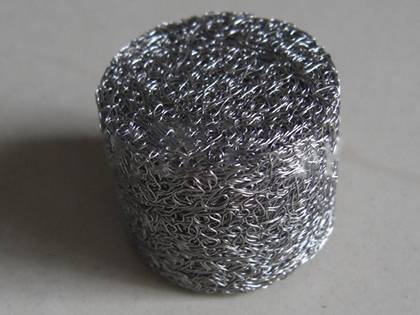 A column shape compressed knitted mesh on the gray background.