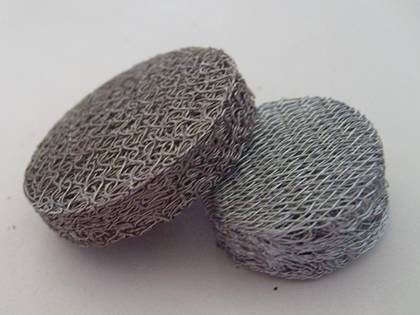Two compressed knitted meshes and one is covered by the expanded metal mesh.