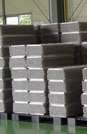 Several parts of demister pads are packed into woven bags.