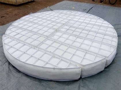 A round shape FEP demister pad on the ground.