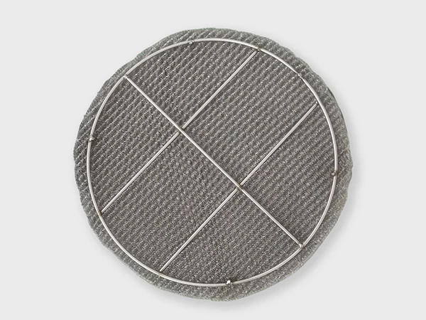 A ginning knitted wire mesh demister pad on the white background.