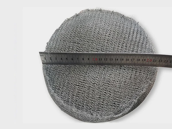 Measure the diameter of the round shape knitted mesh mister pad with a ruler.