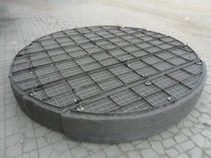 A drawer mister pad with supporting mesh and grating on the ground.