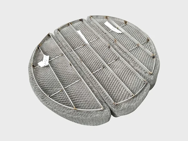 A nickel wire demister pad is standing on the white background.
