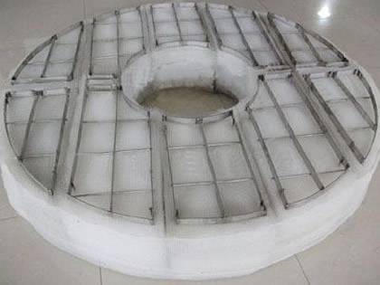 A ring shape PVC demister pad on the ground.