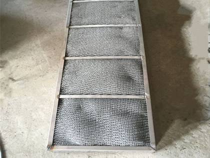 A rectangular shape stainless steel demister pad on the ground.