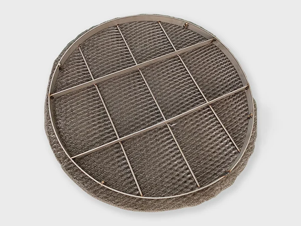 A round shape stainless steel demister pad on the white background.